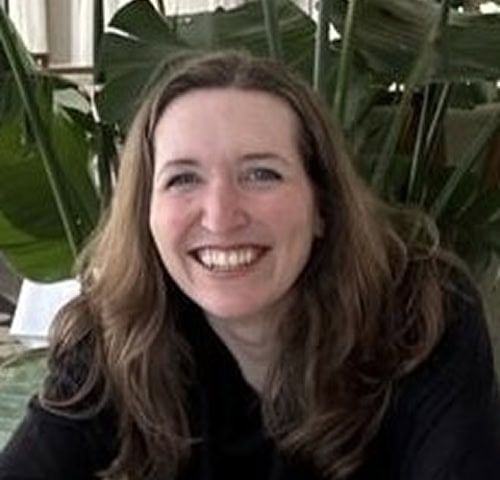 Bright smiling woman with long curly hair
